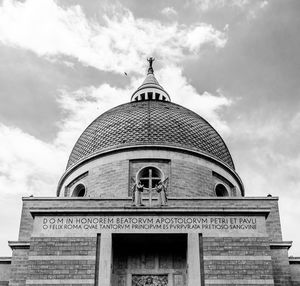 Low angle view of building against cloudy sky