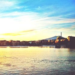 Buildings in city at sunset