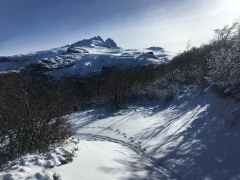 Snow covered mountain against sky