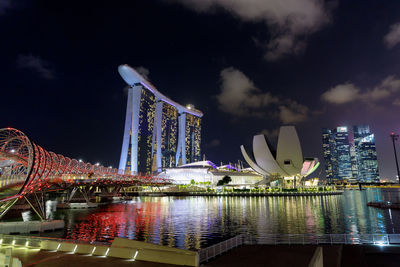 Illuminated modern buildings in city at night