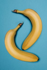 High angle view of bananas against blue background