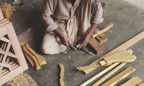 High angle view of man working on wood