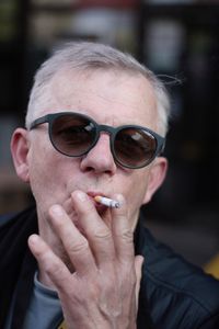 Close-up of young man wearing sunglasses