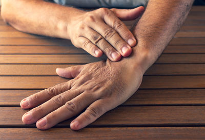 Close-up of people hands on table