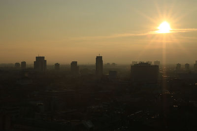 Cityscape against sky during sunset