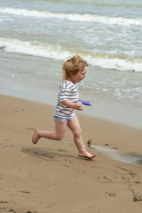 Full length of boy on beach