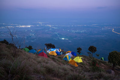 View of tents on mountains against sky