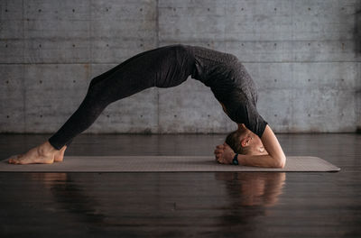 Female practice morning yoga indoor