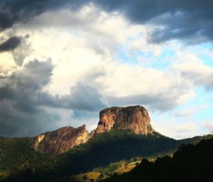 Low angle view of rock formations against sky