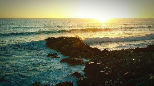 Scenic view of sea at sunset