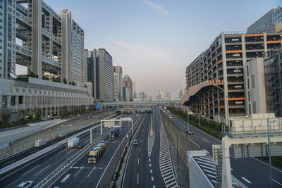 High angle view of traffic on road amidst buildings in city