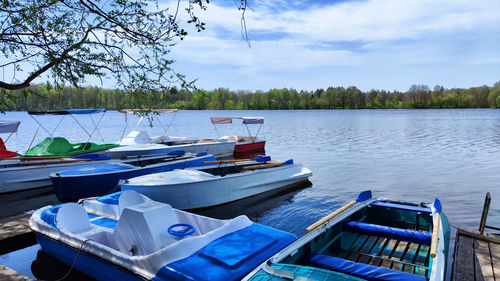 Boats moored in lake