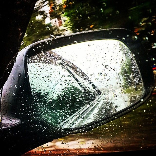 drop, wet, transportation, car, water, glass - material, rain, transparent, land vehicle, mode of transport, raindrop, window, close-up, season, street, road, reflection, side-view mirror, focus on foreground, weather