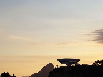 Silhouette mountain against sky during sunset