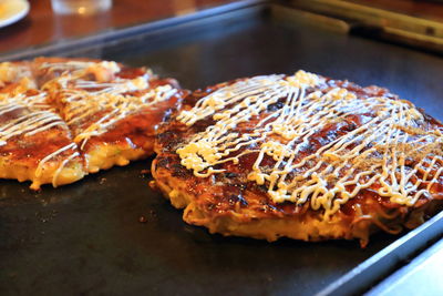 Close-up of barbecued burger patties in tray