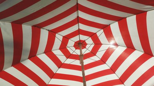 Low angle view of striped parasol