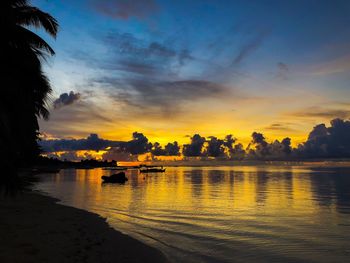 Scenic view of lake against orange sky