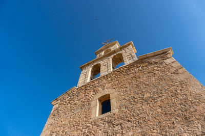 Low angle view of moya's church against clear sky