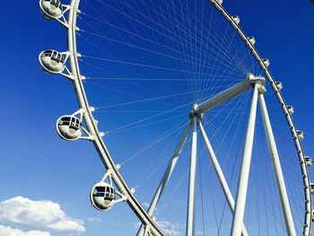 Low angle view of ferris wheel against sky