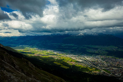 Scenic view of alps against cloudy sky