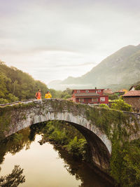 Bridge over river against sky