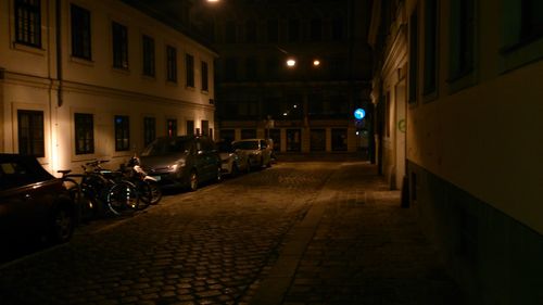 View of illuminated street at night