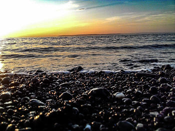 Scenic view of sea at sunset