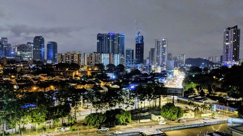 View of skyscrapers lit up at night