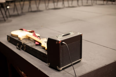 Close-up of guitar on stage