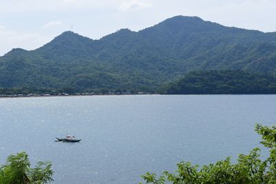 Scenic view of river and mountains