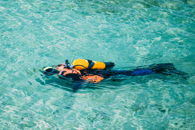 High angle view of man swimming in sea