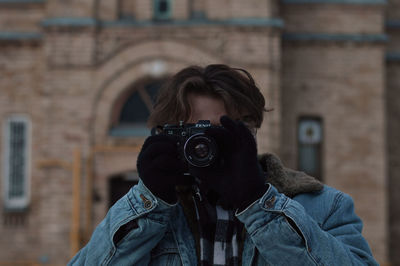 Close-up of woman photographing outdoors