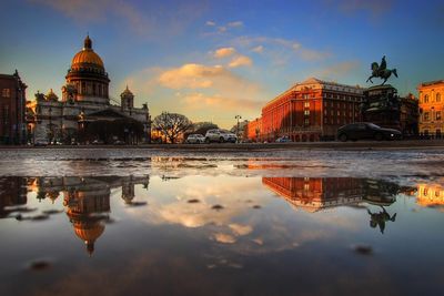 Reflection of buildings in water at dusk