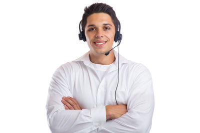 Portrait of a smiling young man against white background