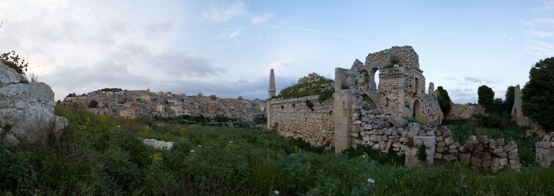 Low angle view of old ruin building against sky