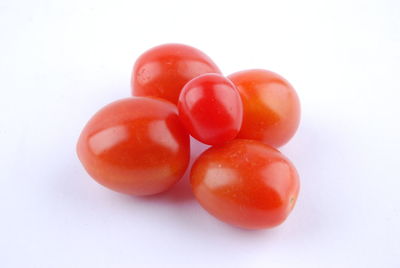 Close-up of tomatoes against white background