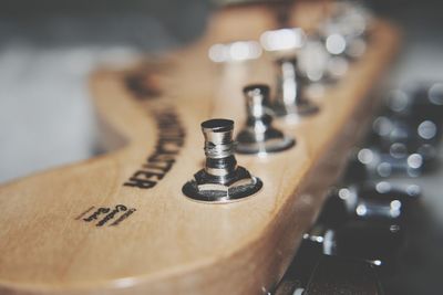 Close-up of guitar on table