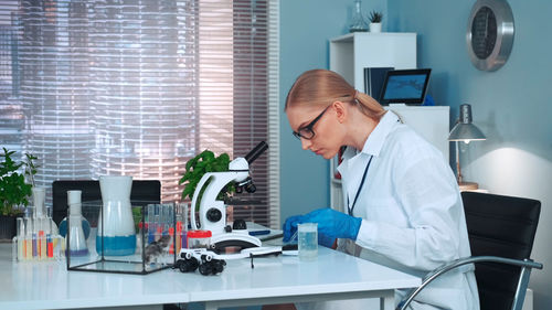 Female doctor working in office