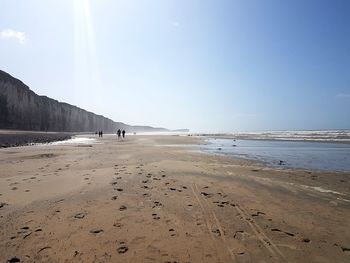 Scenic view of beach against clear sky