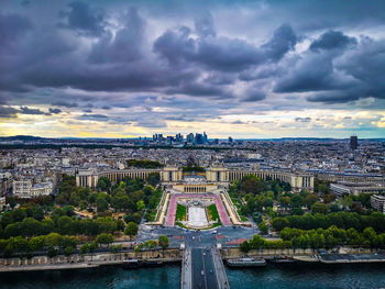 Bridge over river against buildings in city