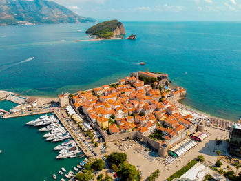 Aerial drone photo of budva old town in from birds eye view in summer.