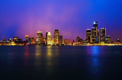 Illuminated city at waterfront