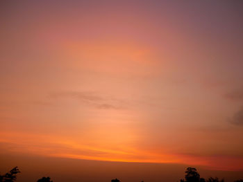 Low angle view of dramatic sky during sunset