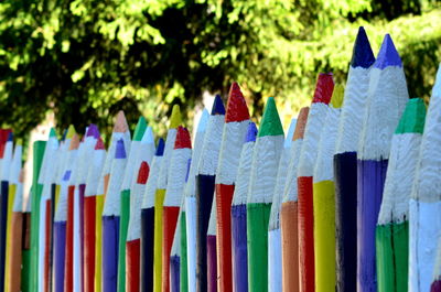 Close-up of multi colored pencils in row