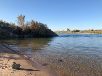 Scenic view of lake against clear sky