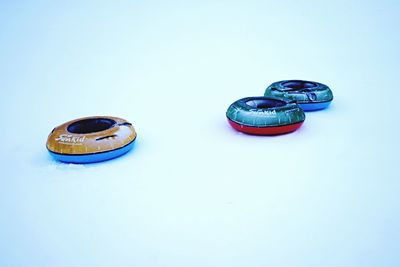 High angle view of coins on white background