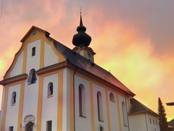 Low angle view of building against sky during sunset