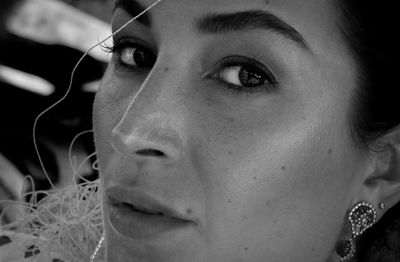 Close-up portrait of young woman looking away