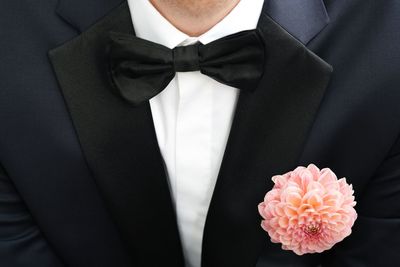 Midsection of man wearing bow tie