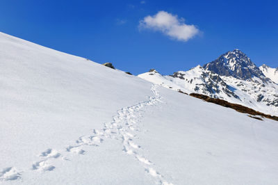 Scenic view of snowcapped mountains against sky